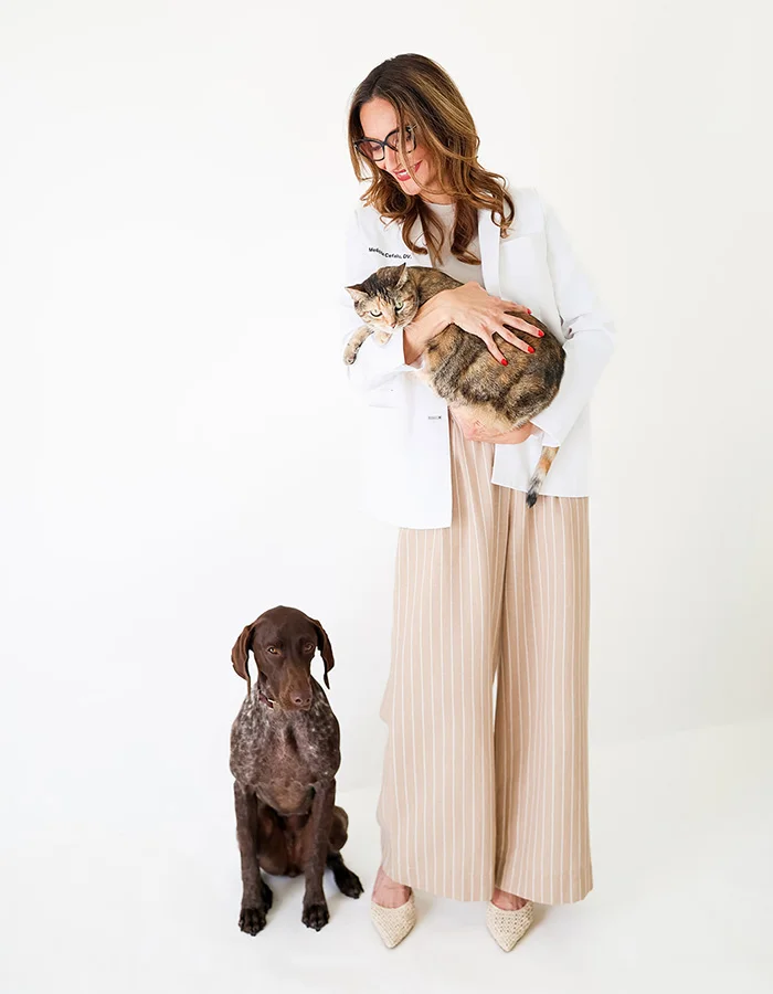 dr-holding-cat-looking-at-dog Dr. Melissa Cefalu with a cat and dog